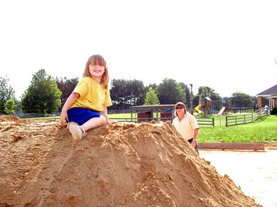 Kaylynn determining if the sand is good for the foundation