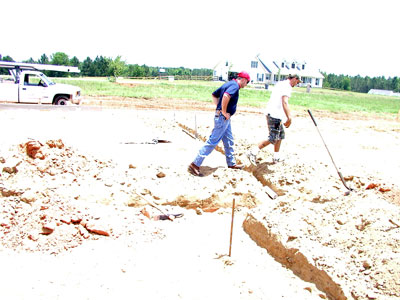M&L Plumbers at work laying out the drain lines
