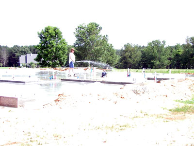 Curing the slab by spraying it down...