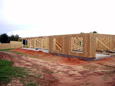 Completly wrapped house with strack of trusses waiting to be placed...
