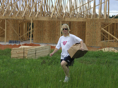 Tricia runing home with her New Heater/massage unit from her new tub so no one takes it...