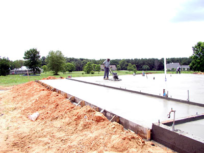 Disking the main slab... a broom finish will go on the porches ... the garage gets disked also...