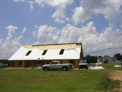 The roof sheathing is almost finished....