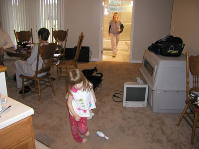 Christmas morning .. tricia tying to keep up with kid and puppies