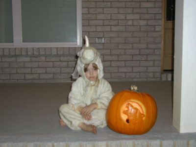 Kaylynn in her unicorn costume and pumpkin